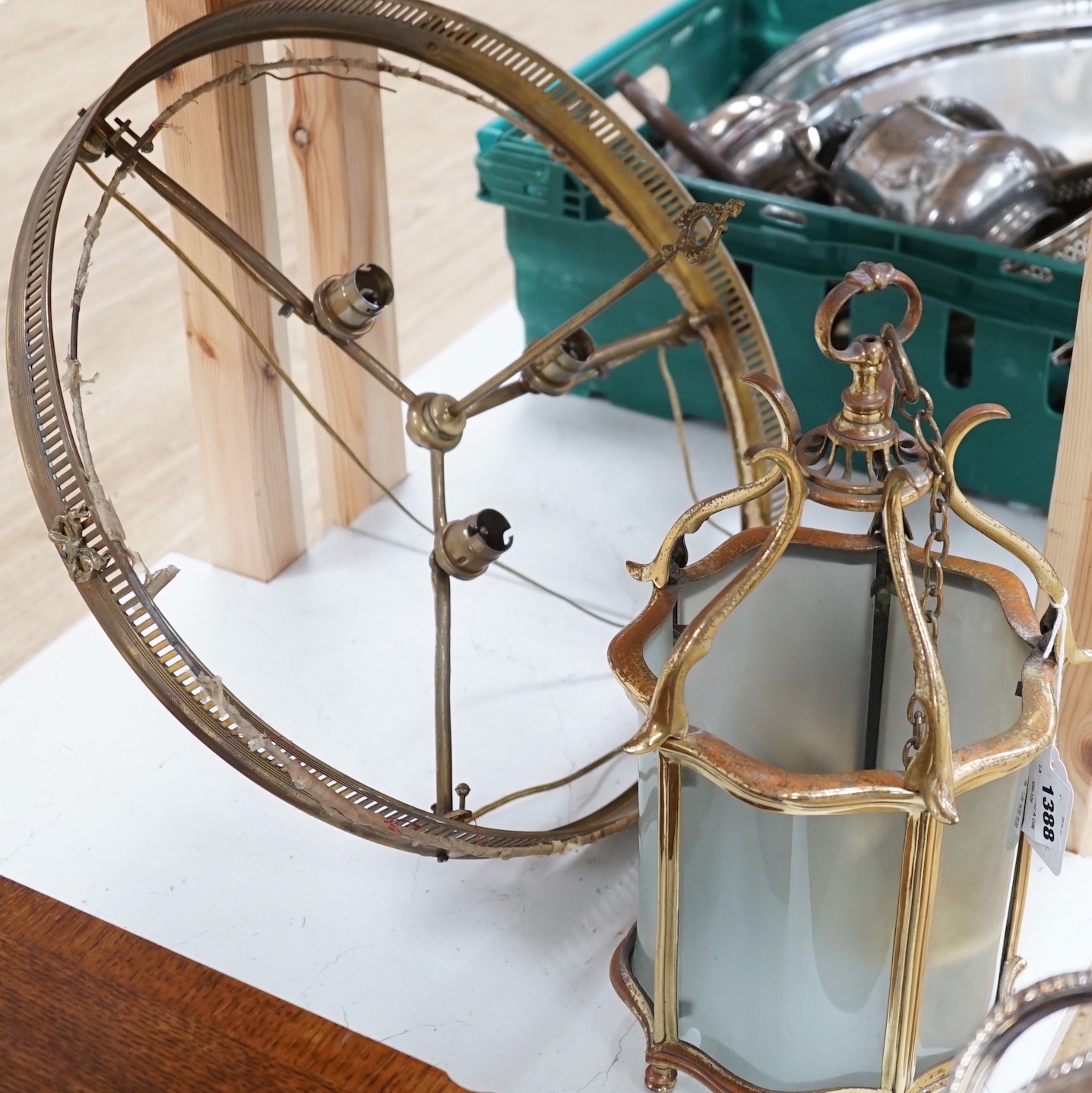 A brass hall lantern and a circular brass ceiling light fitting, hall lantern 40 cms high.